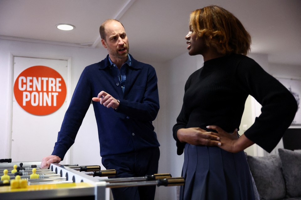 Prince William speaking with a young woman at Centrepoint, a homeless youth charity.