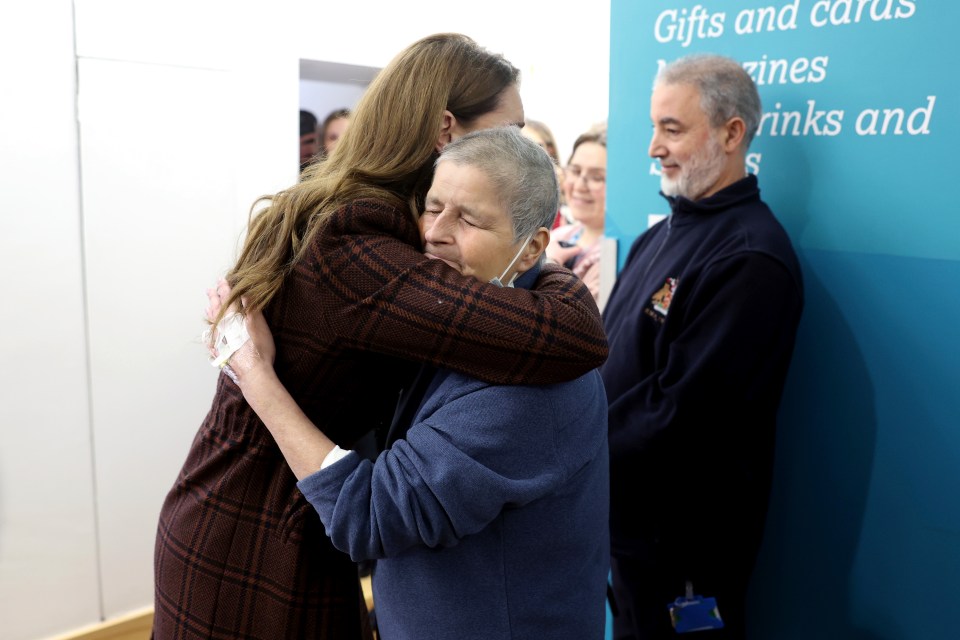 Princess Kate hugging a cancer patient at a hospital.