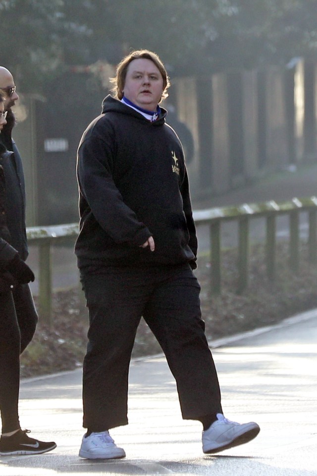 Lewis Capaldi walking with friends.