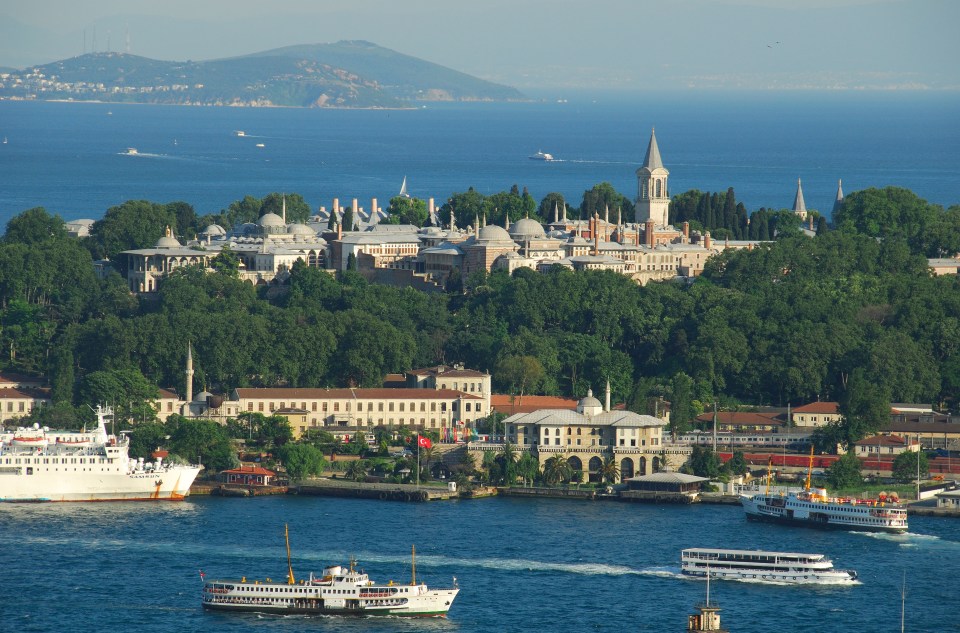 Aerial view of Topkapi Palace in Istanbul, Turkey, with the Golden Horn and Sea of Marmara in the background.