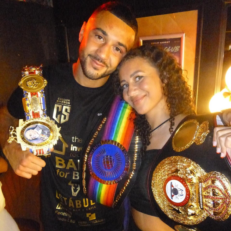 Callum Simpson and Lily-Rae with boxing belts.