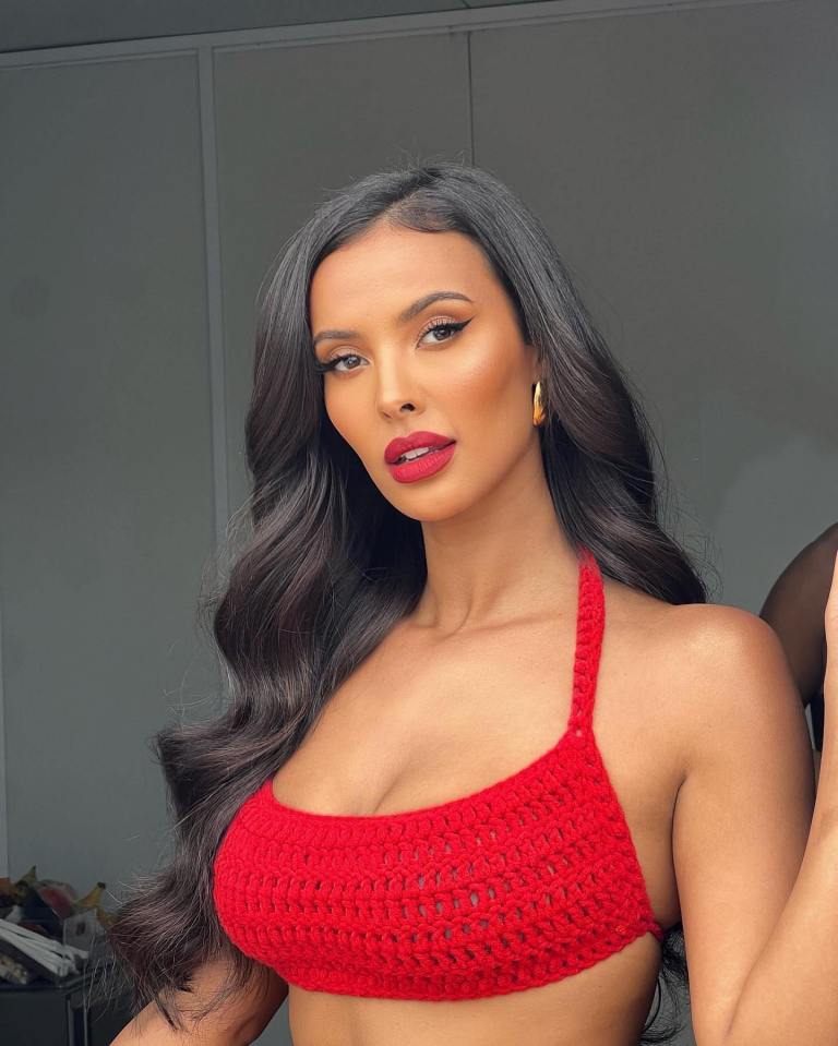 Maya Jama in a red crochet bikini top and skirt.