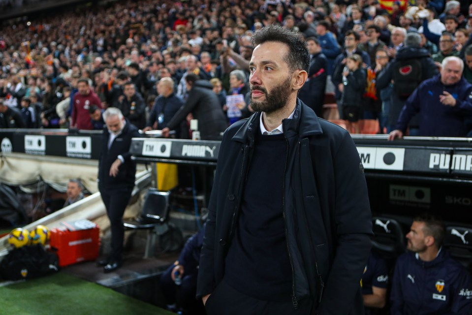 Carlos Corberan, head coach of Valencia CF, on the sidelines of a La Liga match.