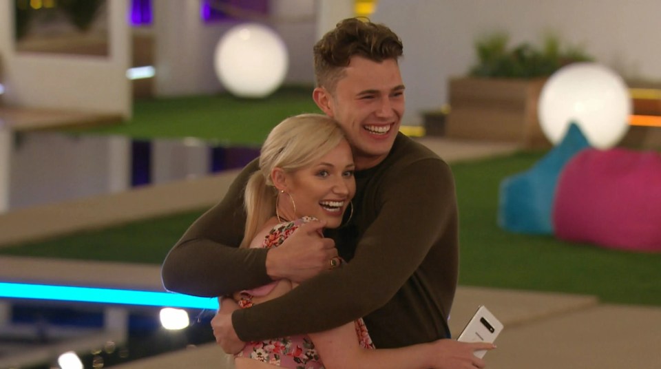 Amy Hart and Curtis Pritchard hugging on Love Island.