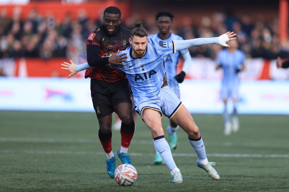 Soccer players battling for the ball.