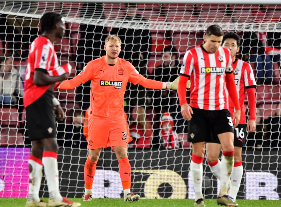 Southampton goalkeeper looks dejected after a goal.