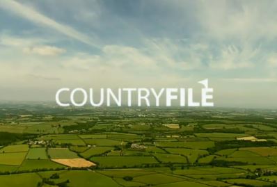 Countryfile logo over an aerial view of farmland.