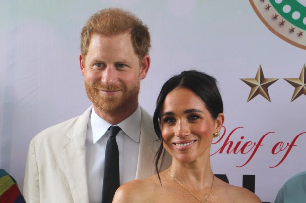 Prince Harry and Meghan Markle at an event in Nigeria.