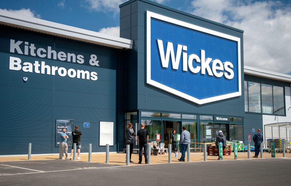 People queueing outside a Wickes DIY store.