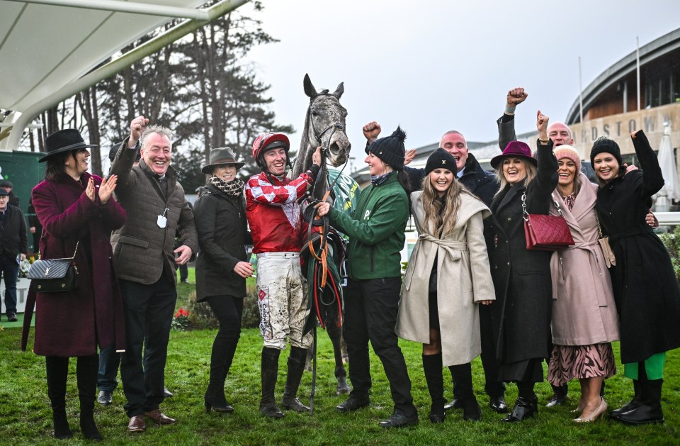 Jack Kennedy with Caldwell Potter and winning connections after a horse race.