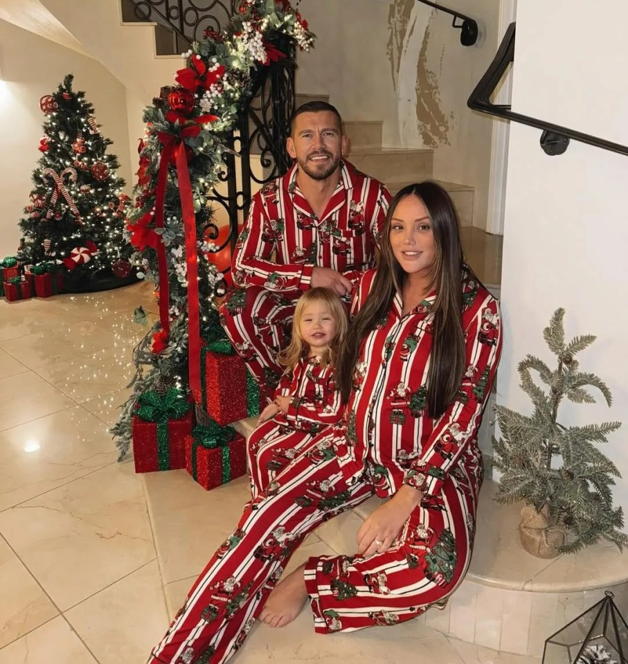 Family in matching Christmas pajamas.