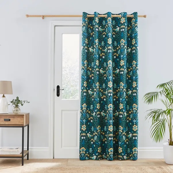 Teal eyelet door curtain with a floral and bird print.