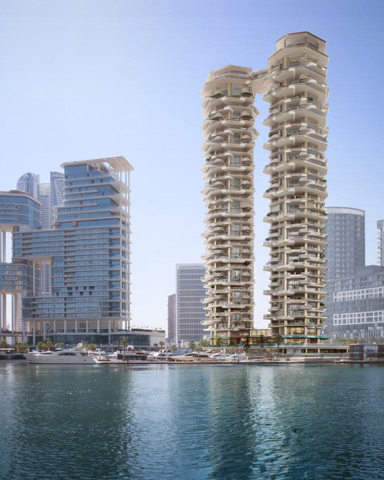 Rendering of two Dubai skyscrapers connected by a rooftop pool.