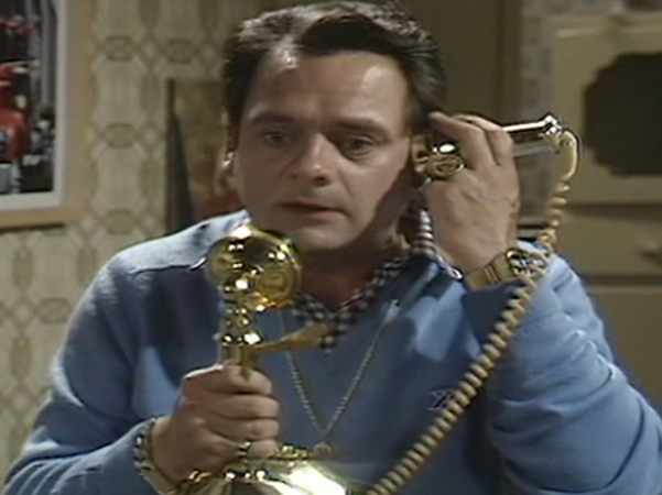 Del Boy using the telephone in an episode of Only Fools and Horses