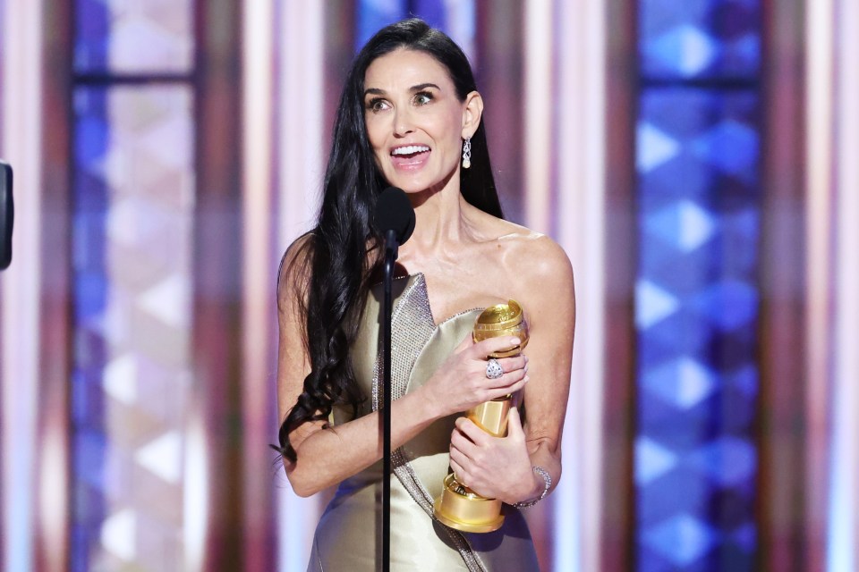 Demi Moore accepting a Golden Globe award.