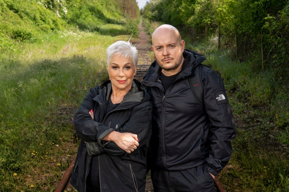 Denise Welch and Lincoln Townley standing by a railway track.