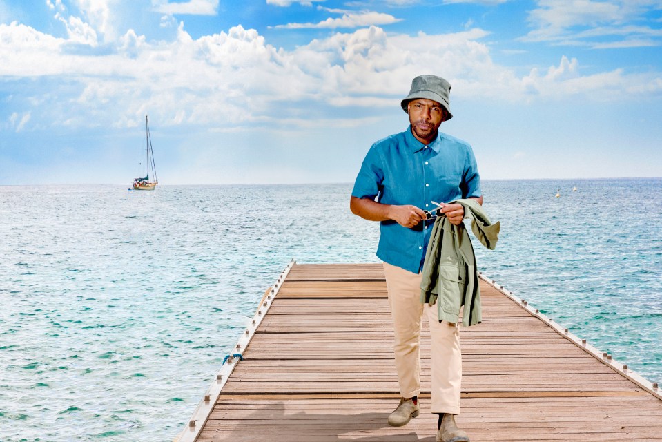 Don Gilet on a dock by the ocean.