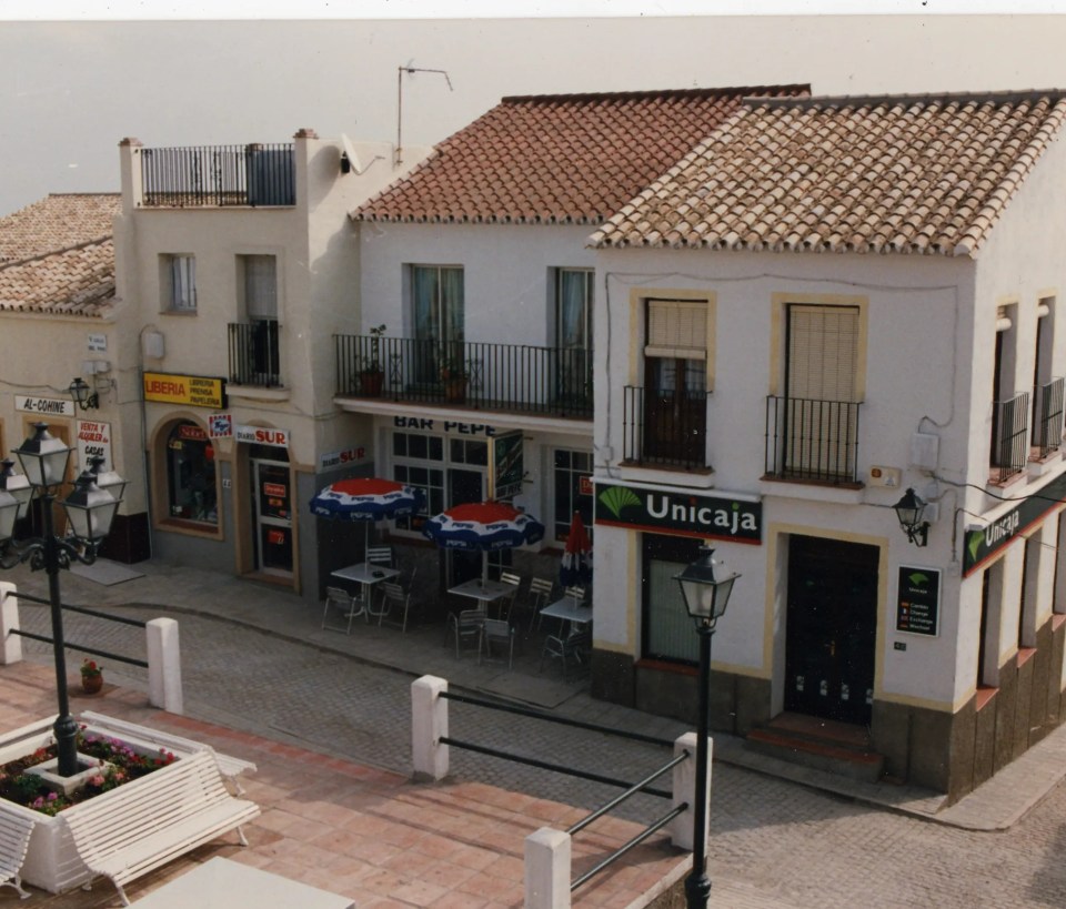 Street scene with shops and a bank.