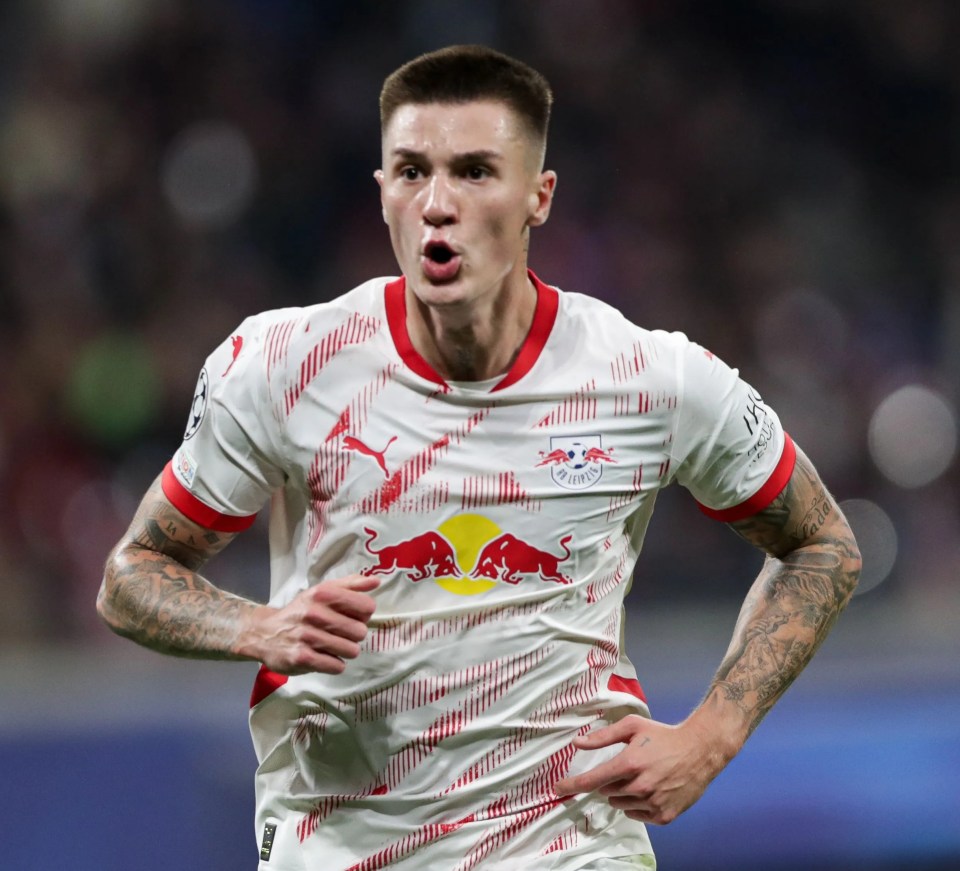 Benjamin Sesko of RB Leipzig celebrating after scoring a goal.