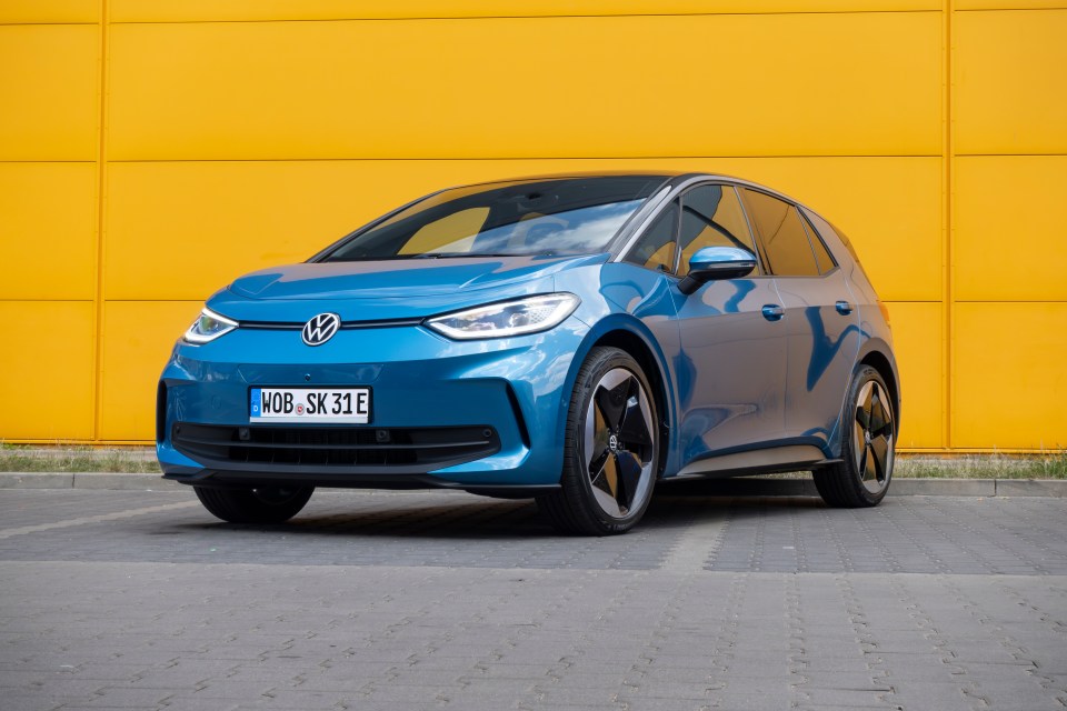 Blue Volkswagen ID.3 electric car parked in a parking lot.