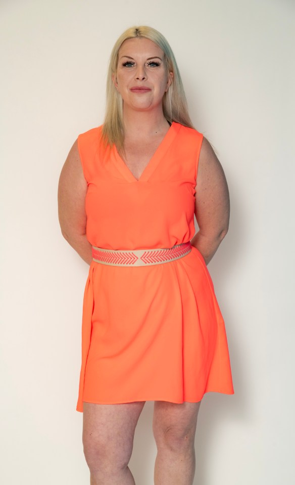 Woman in neon orange dress.