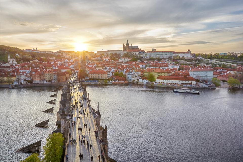 Aerial view of Charles Bridge in Prague at sunset.