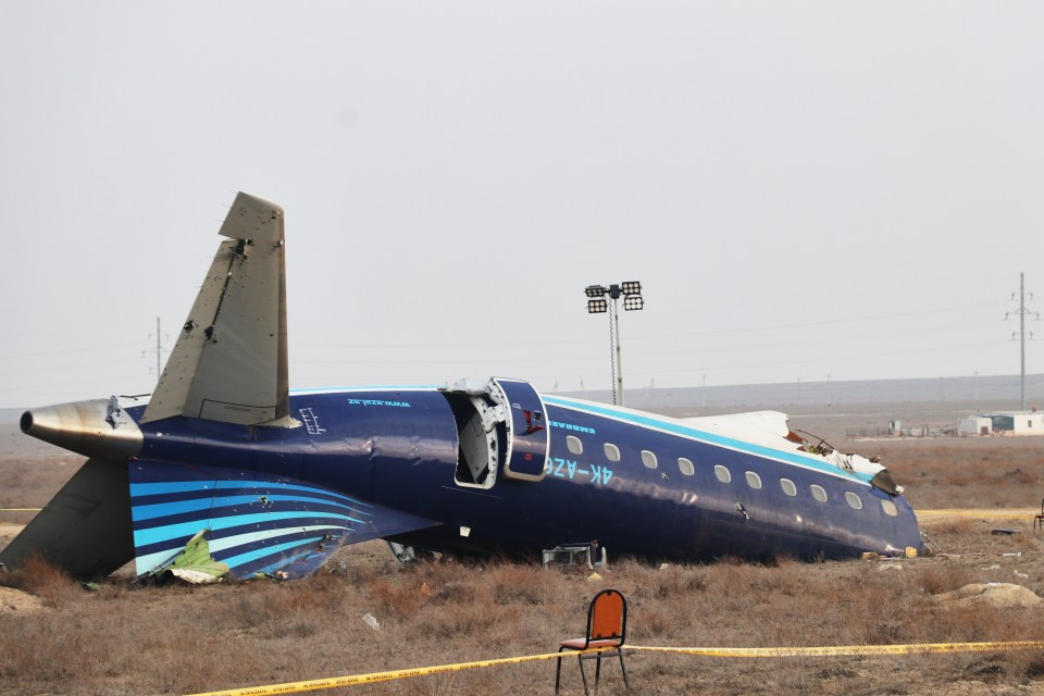 Damaged Azerbaijan Airlines plane at crash site.