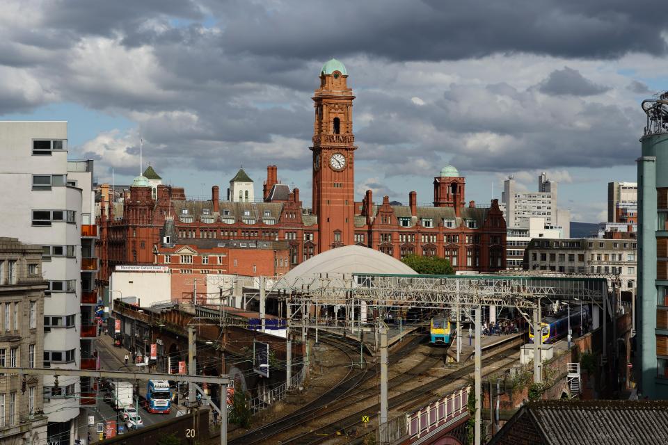 Manchester Oxford Road railway station and the Palace Hotel.