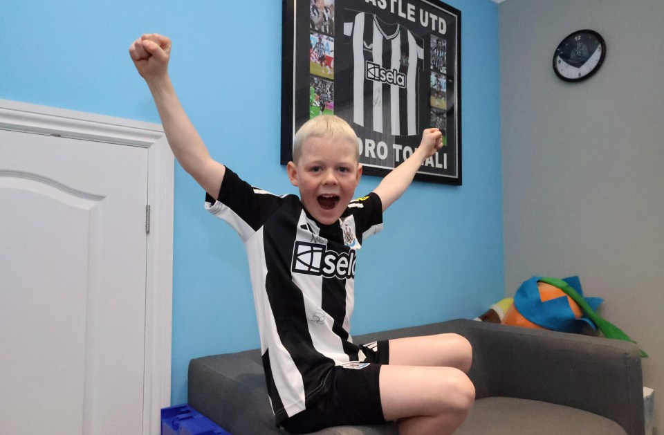 Nine-year-old Sammy Scott celebrating Newcastle United's victory.