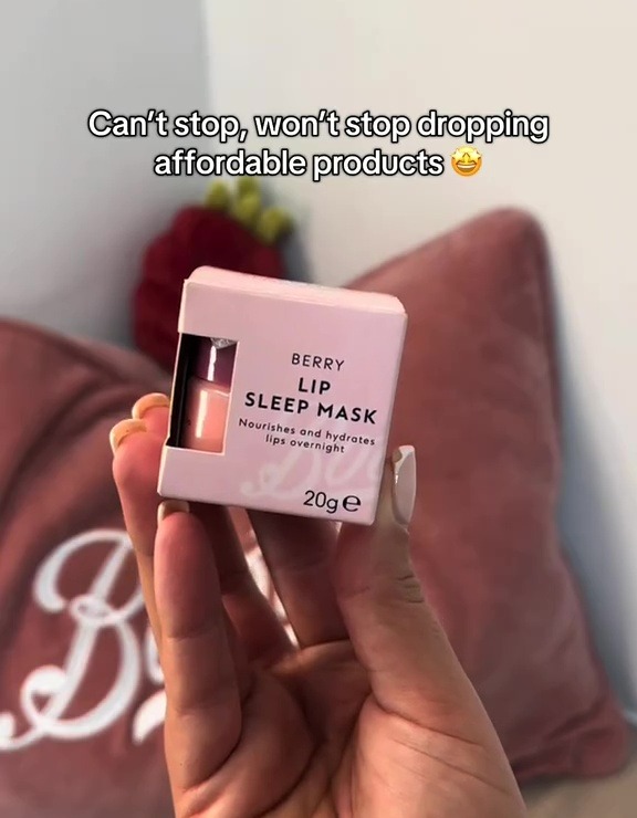 Hand holding a box of Berry Lip Sleep Mask.