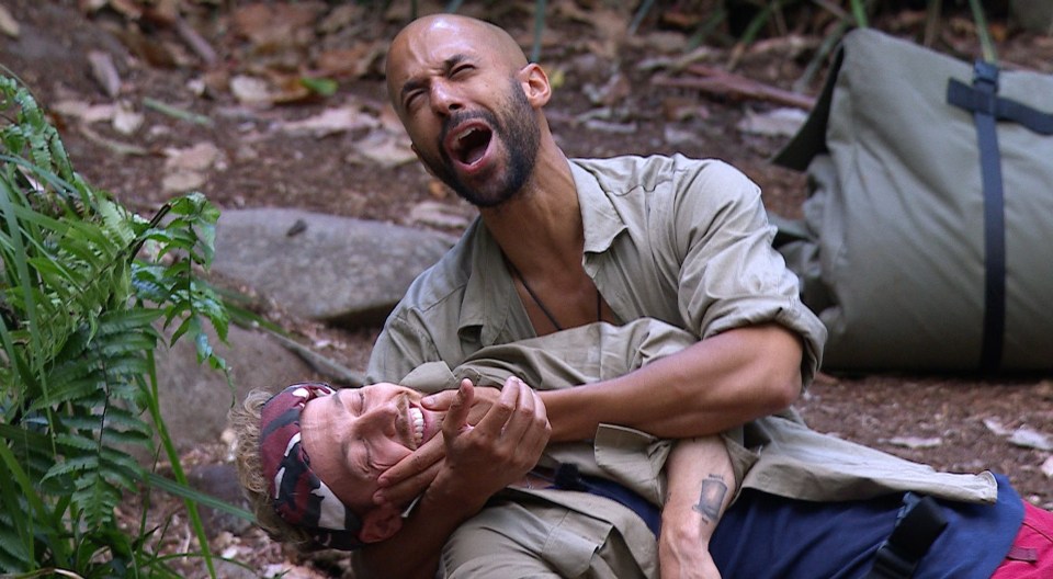 Sam Thompson and Marvin Humes in a playful wrestling match on I'm a Celebrity... Get Me Out of Here!