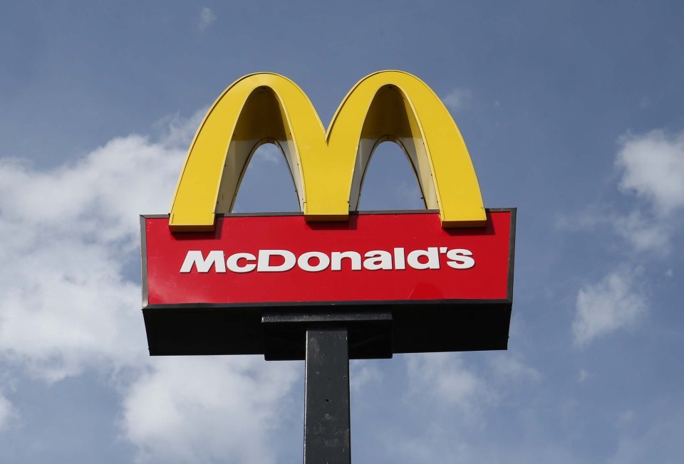 McDonald's sign against a cloudy sky.