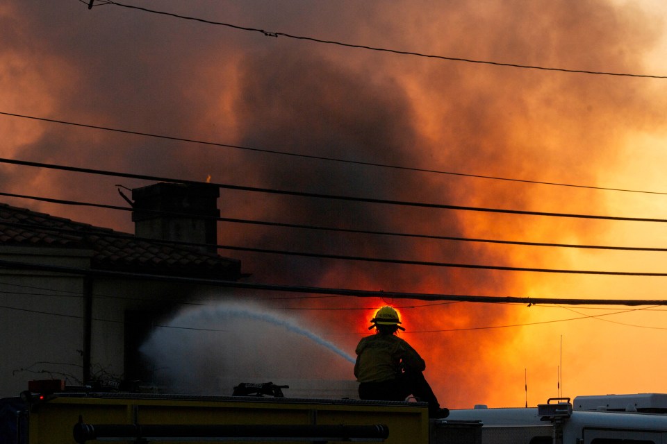 Firefighter battling a large fire.