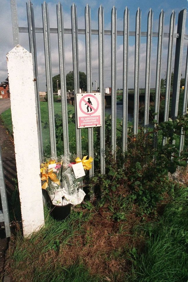 Flowers at a gate outside a pumping station.