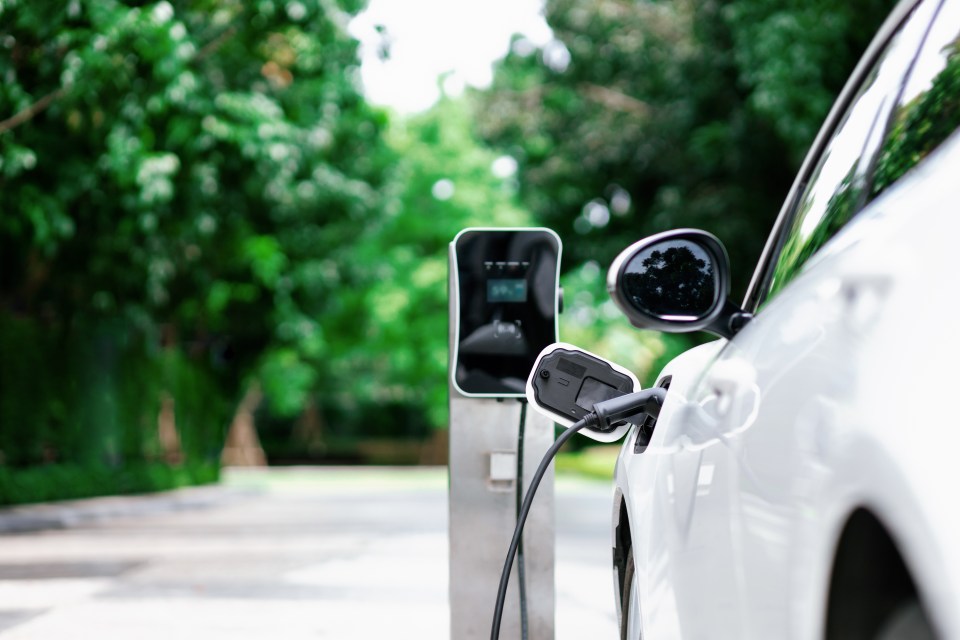 Electric car charging at a station.