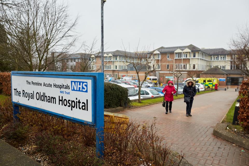 The Royal Oldham Hospital sign and building.