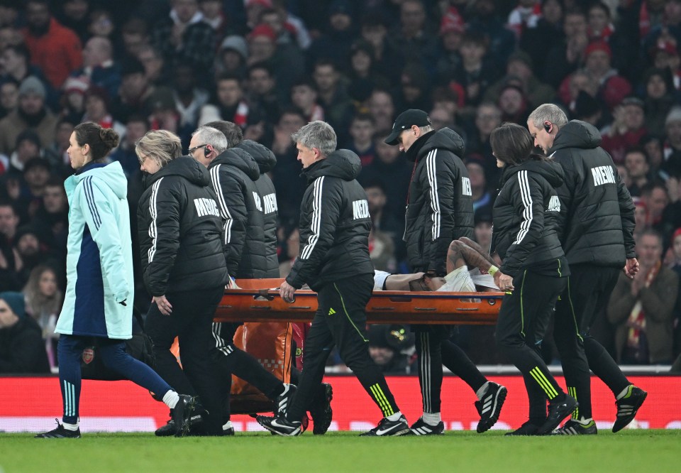 Gabriel Jesus of Arsenal being carried off the pitch on a stretcher.