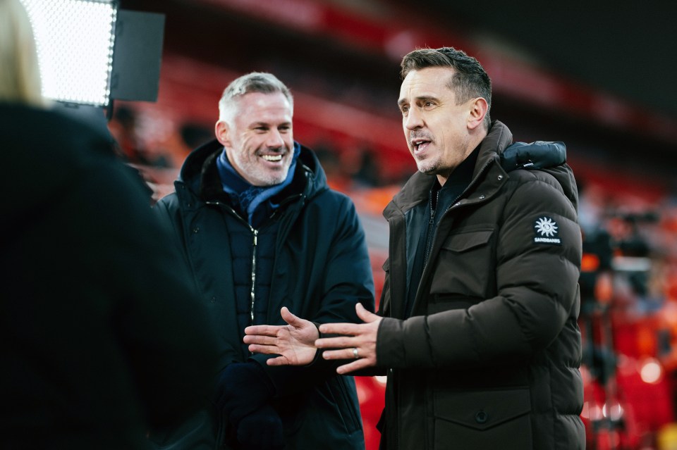 Gary Neville speaking to the media at a soccer match.