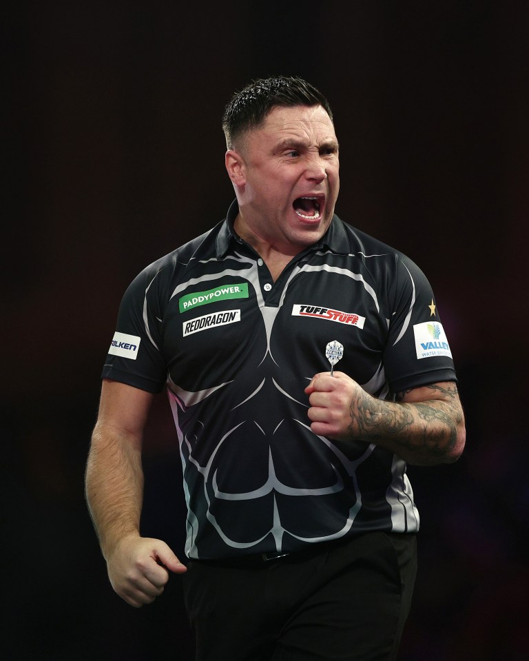 Gerwyn Price of Wales reacting during a darts match.