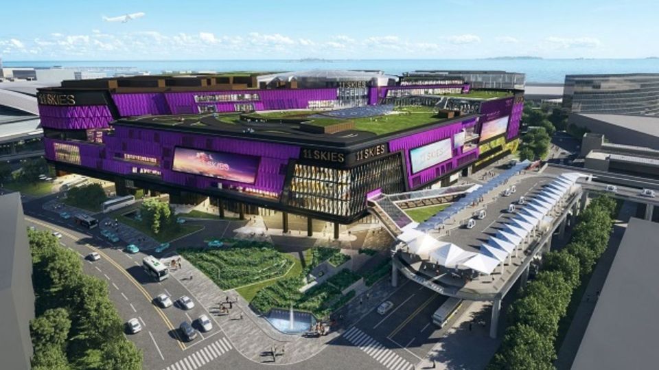 Illustration of Hong Kong airport renovations, showing a new purple building with green roof.