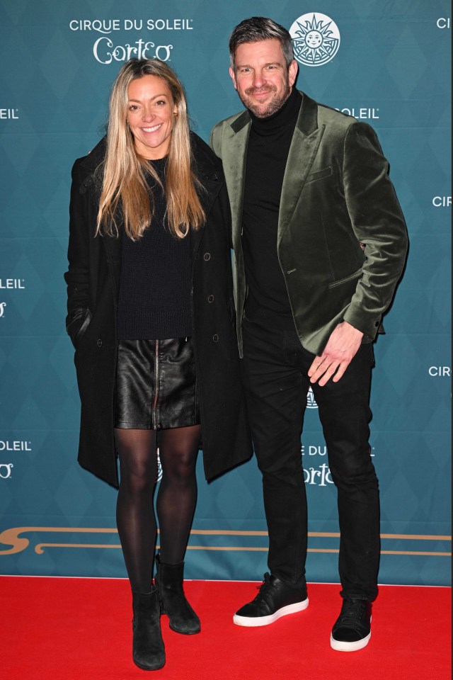 Cherry Healey and a man on the red carpet at the Cirque du Soleil Corteo premiere.