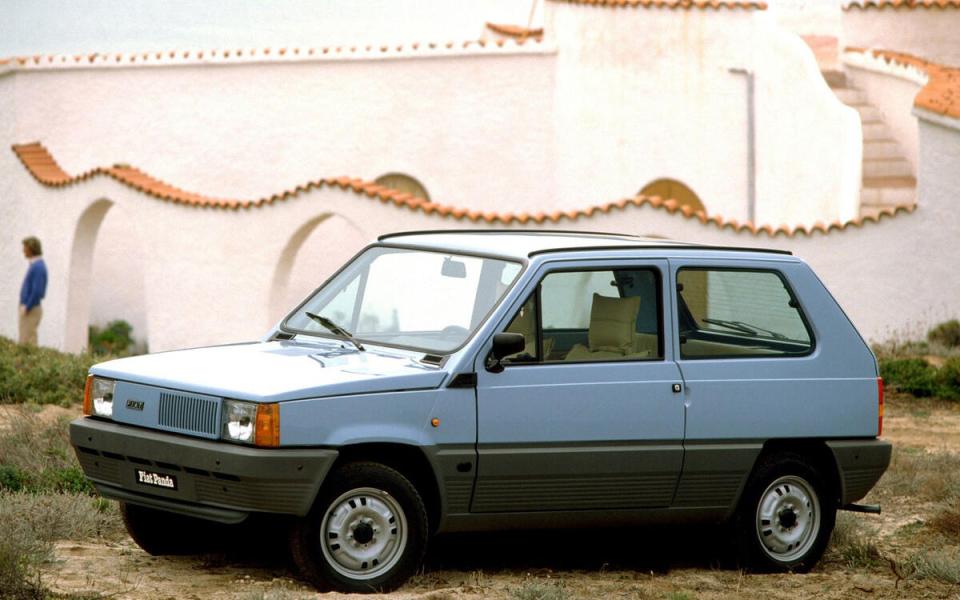 A light blue Fiat Panda parked outdoors.