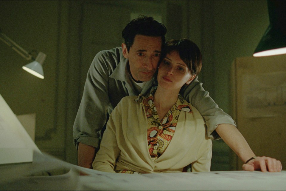 Adrien Brody and Felicity Jones in a scene from "The Brutalist."