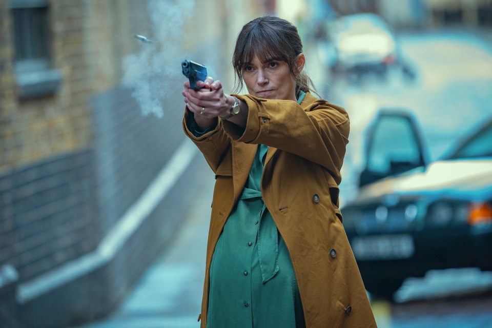 Keira Knightley firing a gun in a scene from Black Doves.