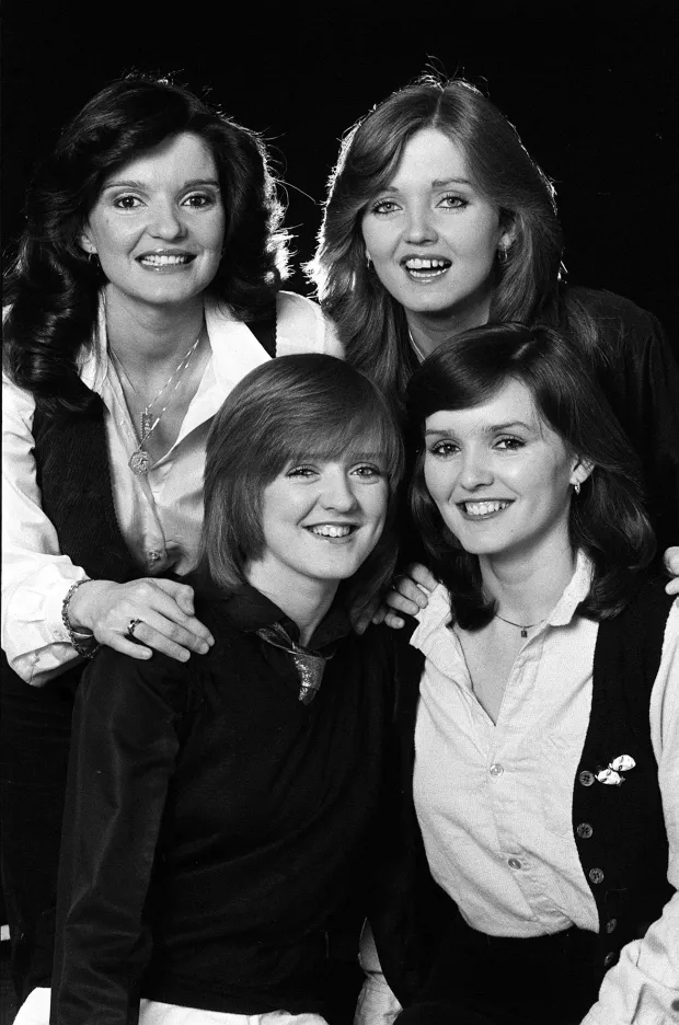 Black and white photo of four women.