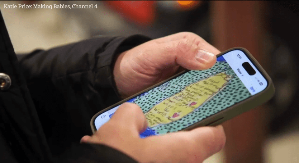 Person viewing a handwritten note on a smartphone.