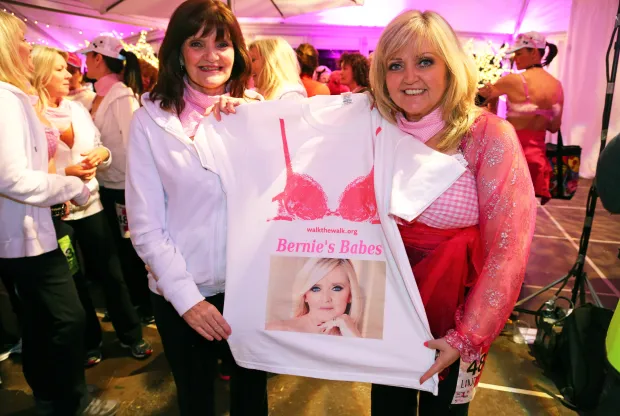 Two women holding a Bernie's Babes t-shirt.