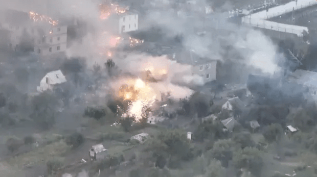 Aerial view of buildings on fire.