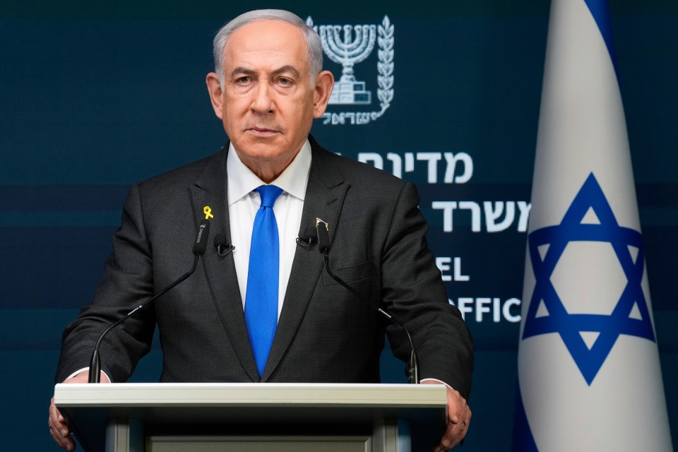 Benjamin Netanyahu speaking at a podium.