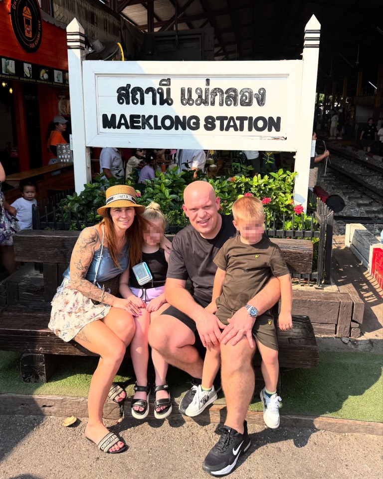 Family at Maeklong Station in Thailand.